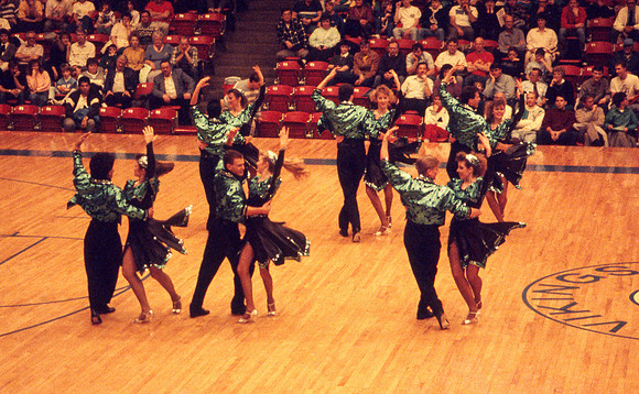 Ballroom dancers performing in gym. Feb 1990