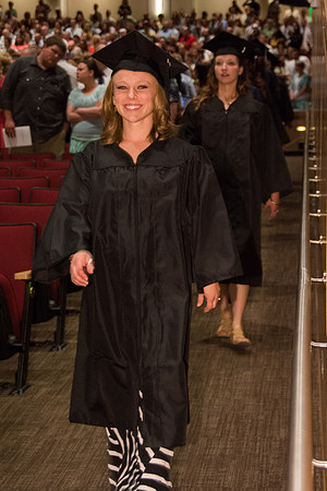 BYU-Idaho graduates walk in to the commencement ceremony, held in the BYU-Idaho Center.