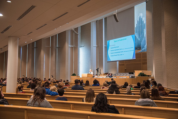 Parents of upcoming college students participate in a Conference session in the Taylor Chapel.