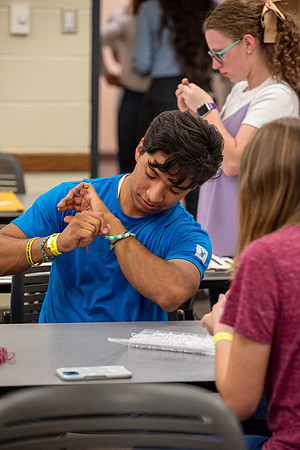 Freshman and other students on campus at I-Night. They participate in many activities.