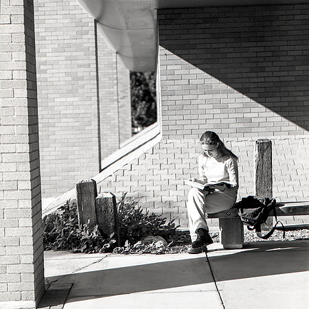 1988 - Student studying outside Romney building.