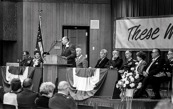 1988 - A formal event with President Joe J. Christensen and military officers sitting on stage in the Manwaring Center Ballroom.