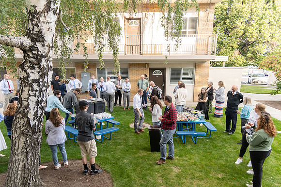 Online Learning employees gather to have breakfast and hear remarks from Vice President Kendall Peck.