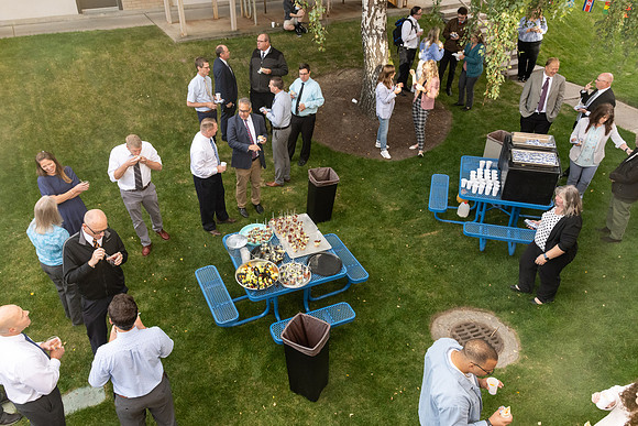 Online Learning employees gather to have breakfast and hear remarks from Vice President Kendall Peck.