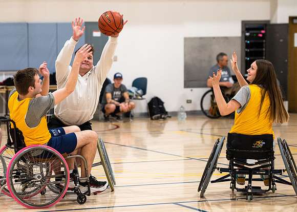 Students participate of Wheelchair Basketball in the Hart Gym.