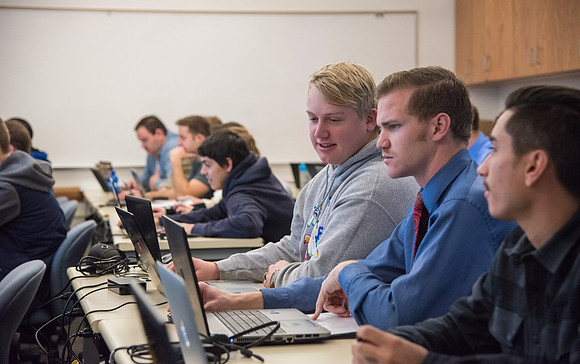 Students work in class learning about Construction Management.