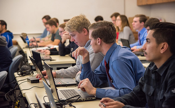 Students work in class learning about Construction Management.