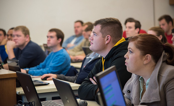 Students work in class learning about Construction Management.