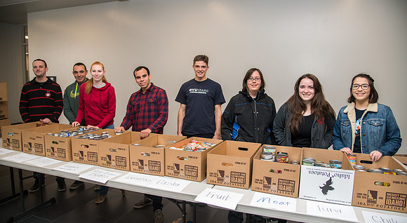 Rexburg YSA 6th Stake members do a service project and collect food items for the food bank.