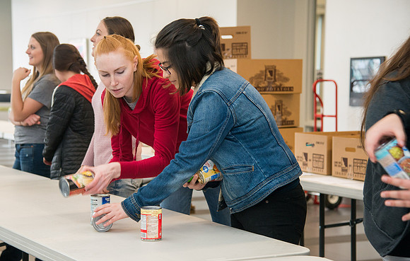 Rexburg YSA 6th Stake members do a service project and collect food items for the food bank.