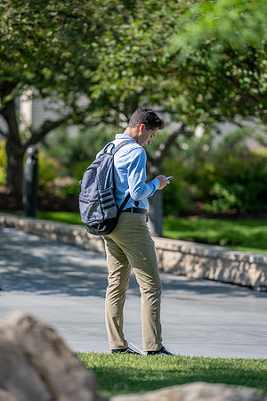 Student on phone outside the Taylor building