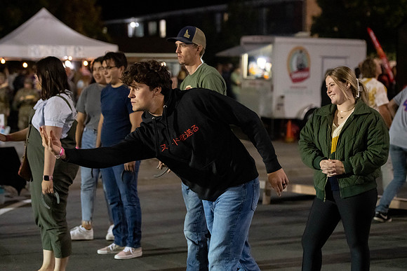 Students gather on campus to celebrate First Friday events.