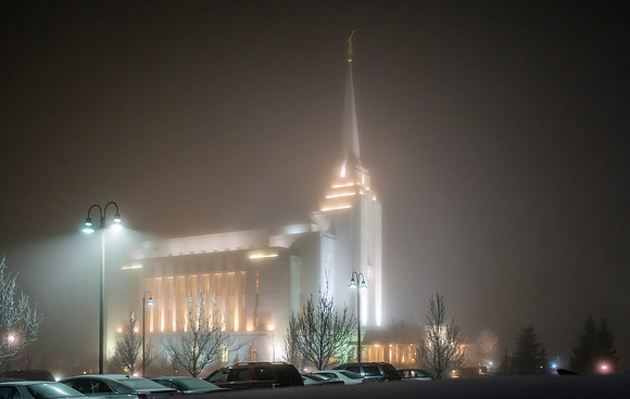 Rexburg Temple lights cut through the fog on a cold winter night.