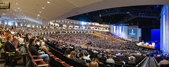Students gather in the BYU-Idaho Center for devotional with Elder Jaun Pablo Villar, General Authority Seventy.