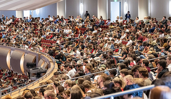 Students gather in the BYU-Idaho Center for devotional with Elder Jaun Pablo Villar, General Authority Seventy.
