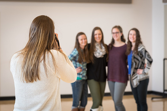 Courtney Mitchell takes a group photo of the Dance Society. 2017