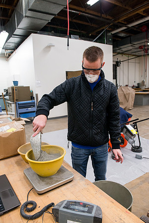 Civil engineering students work with different mixtures of cement to make a light, yet durable, cement that will be the building material for a canoe.