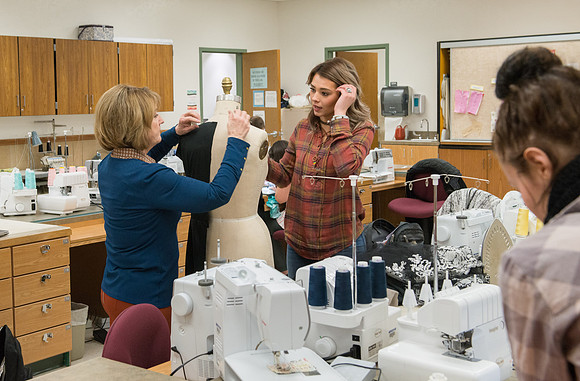 Students in Genet Ormes Apparel Entrepreneurship class work on their final project.