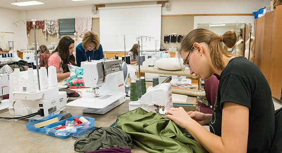 Students in Genet Ormes Apparel Entrepreneurship class work on their final project.