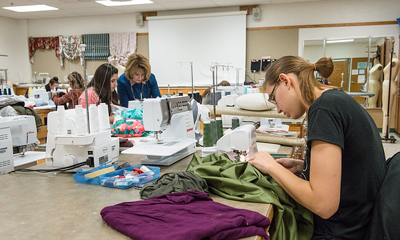 Students in Genet Ormes Apparel Entrepreneurship class work on their final project.