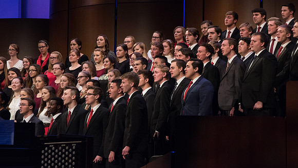 The Combined Women's and Men's Choir sings, "What Shall We Give," during Commencement.