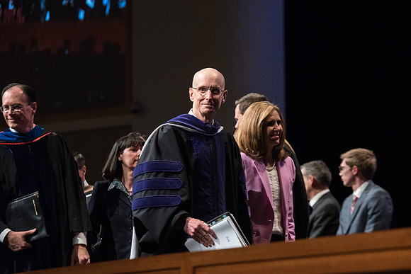 President Henry J. Eyring escorts Sister Kelly C. Eyring from Commencement.