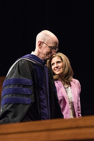 President Henry J. Eyring escorts Sister Kelly C. Eyring from Commencement.