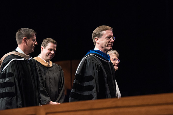 Mark B. Woodruff exits Commencement.