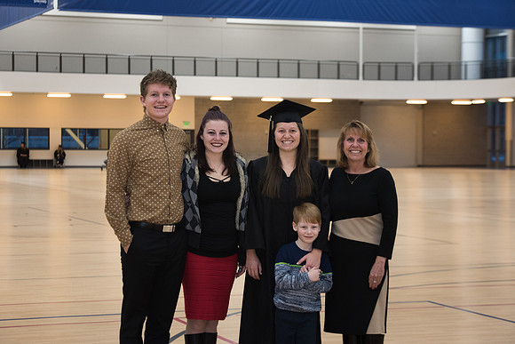 Graduates meet in the I-Center Courts for Processional.