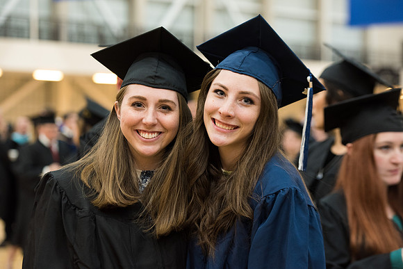 Graduates meet in the I-Center Courts for Processional.