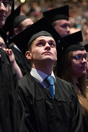 Graduates come to their seats during processional.
