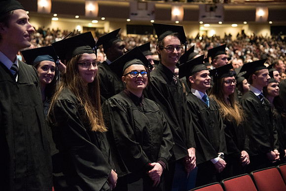 Graduates come to their seats during processional.