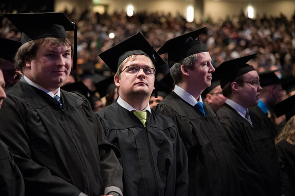 Graduates come to their seats during processional.