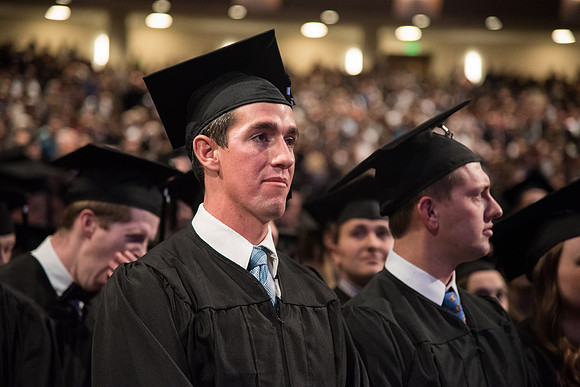 Graduates come to their seats during processional.