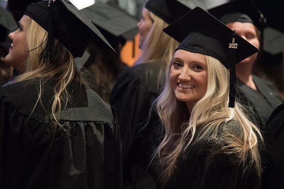 Graduates come to their seats during processional.