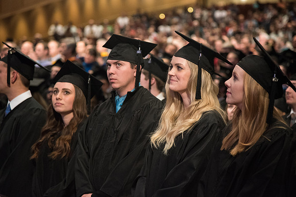 Graduates come to their seats during processional.