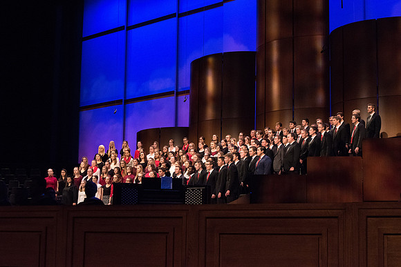 The Combined Women's and Men's Choir sings, "What Shall We Give," during Commencement.