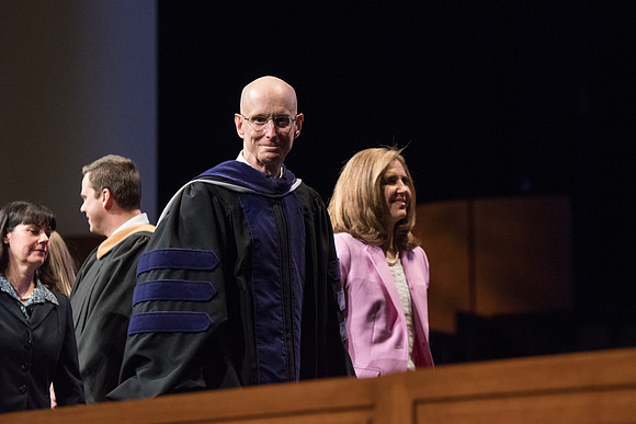 President Henry J. Eyring escorts Sister Kelly C. Eyring from Commencement.