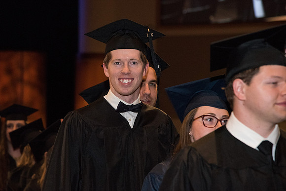 Graduate, Eric Whitlock, now exits the I-Center to meet with his family for Convocation.