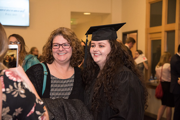 Graduates and families capture the moment after Commencement.