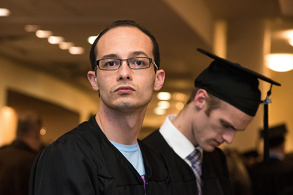 Graduate, Derek Hinds, does not like his photo being taken.