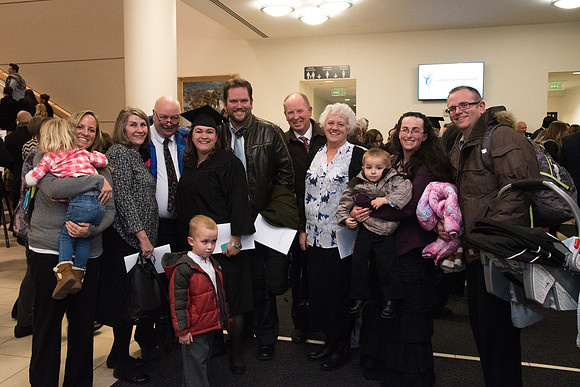 Graduates and families capture the moment after Commencement.