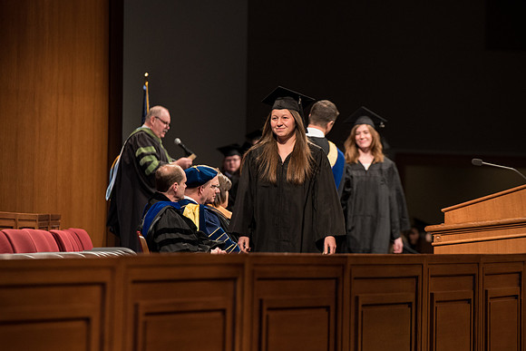 Recreation Management Major, Heather Yule, accepts her diploma and walks for Graduation.