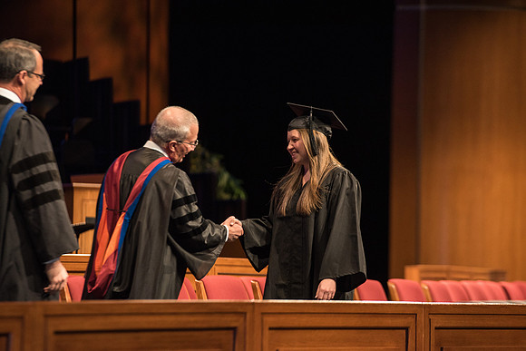 Recreation Management Major, Heather Yule, accepts her diploma and walks for Graduation.