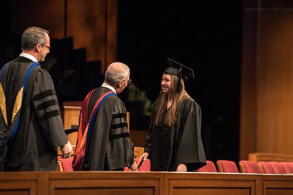Recreation Management Major, Heather Yule, accepts her diploma and walks for Graduation.