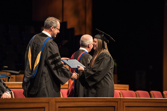 Recreation Management Major, Heather Yule, accepts her diploma and walks for Graduation.