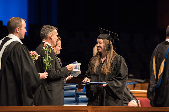 Recreation Management Major, Heather Yule, accepts her diploma and walks for Graduation.