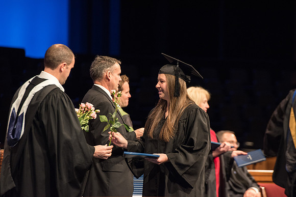 Recreation Management Major, Heather Yule, accepts her diploma and walks for Graduation.