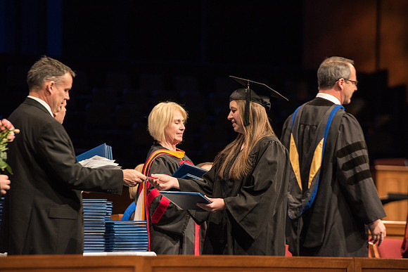 Recreation Management Major, Heather Yule, accepts her diploma and walks for Graduation.