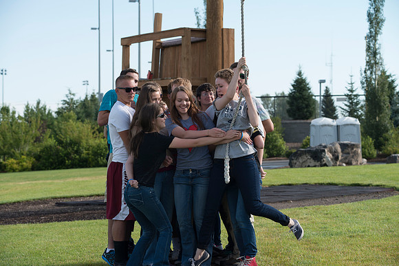 Youth high enjoy the Ropes Course class.